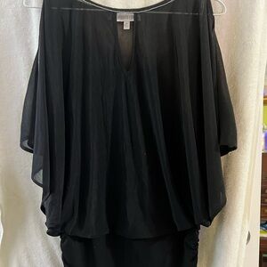 Jennifer Lopez Black blouse with white tag detail and an under tank